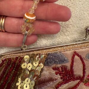 Elegant Beaded Clutch with Gold and Red Accents